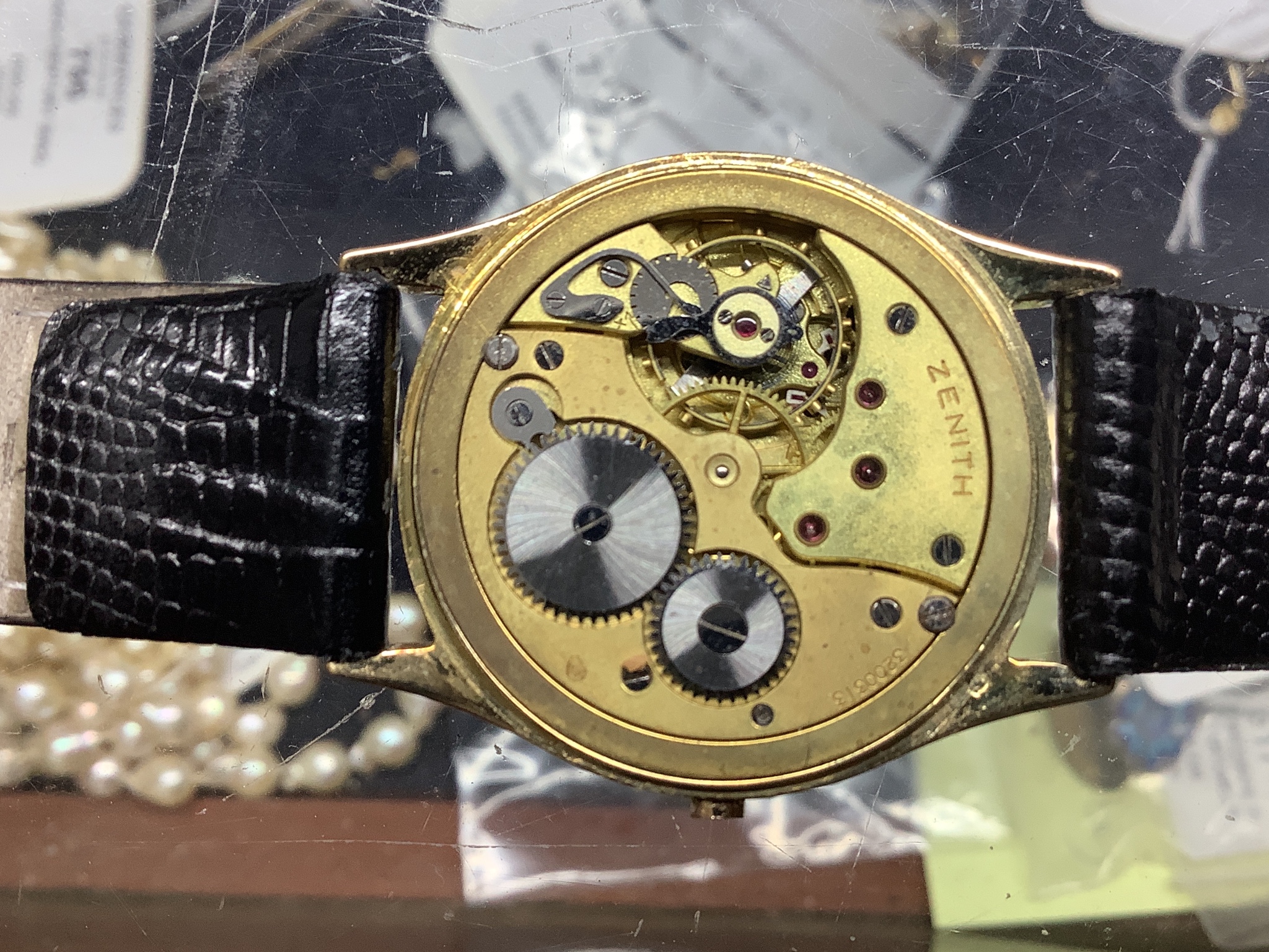 A gentleman's 14k yellow metal Zenith manual wind wrist watch, with subsidiary seconds, on later strap, winding crown loose but present